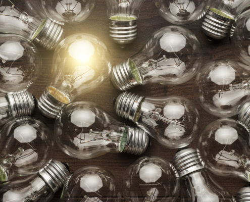 Several light bulbs with one lit