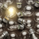 Several light bulbs with one lit